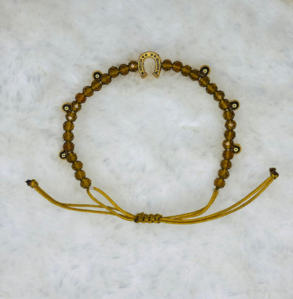 PULSERA MARONA MIEL CON BOLITAS DORADAS