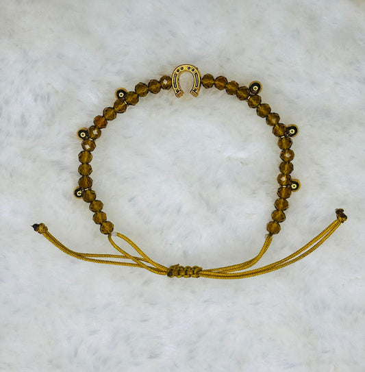 PULSERA MARONA MIEL CON BOLITAS DORADAS